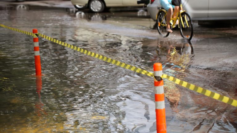 Passenger Switches Roles With Elderly Pedicab Driver Amid Flood